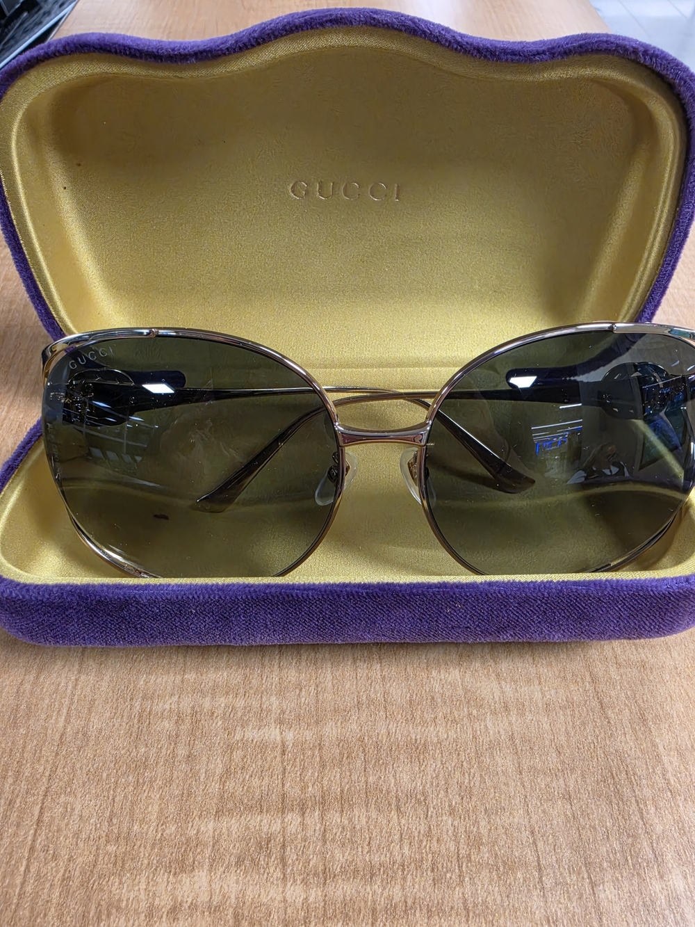 Gucci Women's Gold Frame Sunglasses with Dark Green Lenses